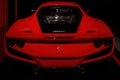 Maranello, Italy - April 01, 2023: Rear view of a red Ferrari with an engine in the trunk. Royalty Free Stock Photo