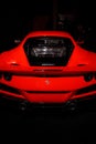 Maranello, Italy - April 01, 2023: Rear view of a red Ferrari with an engine in the trunk. Royalty Free Stock Photo