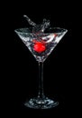 Maraschino cherry dropped in cocktail glass Royalty Free Stock Photo