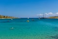 MARATHI, CRETE - 18 JULY 2021: Locals and tourists relaxing on the beach at Marathi on the Chania peninsula of Crete