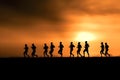 Marathon black silhouettes of runners on the sunrise, neural network generated image Royalty Free Stock Photo