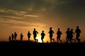 Marathon black silhouettes of runners on the sunrise, neural network generated image Royalty Free Stock Photo