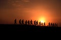 Marathon black silhouettes of runners on the sunrise, neural network generated image Royalty Free Stock Photo