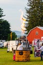 Marathon City, Wisconsin, USA, July 10, 2021, Taste N Glow Balloon Fest. People testing the burners of their hot air balloons Royalty Free Stock Photo