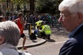 Marathon runner being help by Police