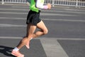 Marathon runner legs running on city Royalty Free Stock Photo