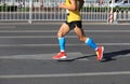 Marathon runner legs running on city Royalty Free Stock Photo