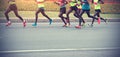 Marathon runner legs running on road Royalty Free Stock Photo