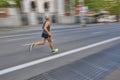 Marathon runner in motion on the street. Healthy lifestyle