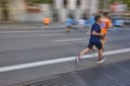 Marathon runner in motion on the street. Healthy lifestyle