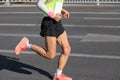 Marathon runner running on city road