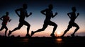 Marathon runner running on city road at sunset. Group of people running on road at night.