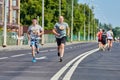 Marathon runners on city road Royalty Free Stock Photo