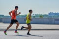 Marathon runners on city road Royalty Free Stock Photo