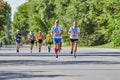 Marathon runners on city road Royalty Free Stock Photo