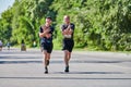 Marathon runners on city road Royalty Free Stock Photo