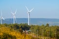 Marathon runners on a mountain with a wind turbine Royalty Free Stock Photo