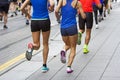 Marathon runners race in city streets