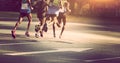 Marathon runners running on city road