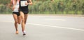 Marathon runners running on city road Royalty Free Stock Photo