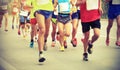 Marathon runners running on city road Royalty Free Stock Photo