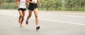 Marathon runners running on city road Royalty Free Stock Photo