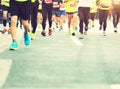 Marathon runners running on city road Royalty Free Stock Photo