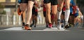 Marathon runners running on city road Royalty Free Stock Photo