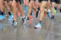 Marathon running race, many runners feet on road racing, sport competition, fitness and healthy lifestyle