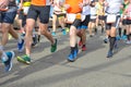 Marathon running race, many runners feet on road racing, sport competition, fitness and healthy lifestyle concept