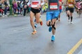 Marathon running race, many runners feet on road racing, sport competition, fitness and healthy lifestyle