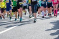 Marathon running race, many runners feet on road racing, sport competition, fitness healthy lifestyle concept Royalty Free Stock Photo