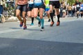 Marathon running race, many runners feet on road racing, sport competition, fitness healthy lifestyle concept