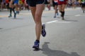 Marathon running race, many runners feet on road, sport, fitness and healthy lifestyle