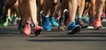 Marathon running race people feet on city road