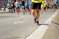 Marathon running race, people feet on road, sport concept Royalty Free Stock Photo