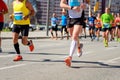 Marathon running race, people feet on road, sport concept Royalty Free Stock Photo