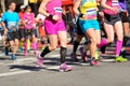 Marathon running race, women runners feet on road