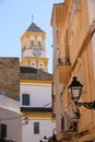 Marbella old town church tower village narrow whitewashed street Royalty Free Stock Photo