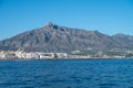 MARBELLA, SPAIN september 09 2021. entrance of port of marbella, puerto banus, with the iconic moutain of marbella