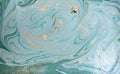 Marble abstract acrylic background. Nature green and blue marbling artwork texture. Golden glitter. Royalty Free Stock Photo