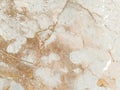 Marble background from a giant white rock. Marble with cracks. Light, gray, beige, pink, yellow, brown natural colors Royalty Free Stock Photo