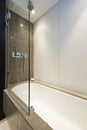 Marble bath tub with slim line shower attachment