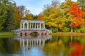 Marble bridge in mellow autumn golden fall in Catherine park, Pushkin, St. Petersburg, Russia Royalty Free Stock Photo