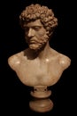 Marble bust of Roman Emperor isolated on black Royalty Free Stock Photo
