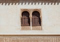 Marble capitals and stucco decoration on two windows in Patio del Cuarto Dorado in Mexuar in Comares Palace Alhambra, Andalusia, Royalty Free Stock Photo