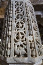 Marble column carved with a beautiful bird and flower pattern in the Jain temple Adinatha temple in Ranakpur, Rajasthan, India