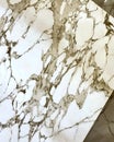 The marble countertop has a pattern of white and brown swirls Royalty Free Stock Photo