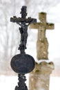 Marble cross on tomb at winter Royalty Free Stock Photo