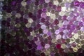 Marble crystal clear ball, rainbow multicolored glitter sparkles background. Selective focus. Multicolored Royalty Free Stock Photo